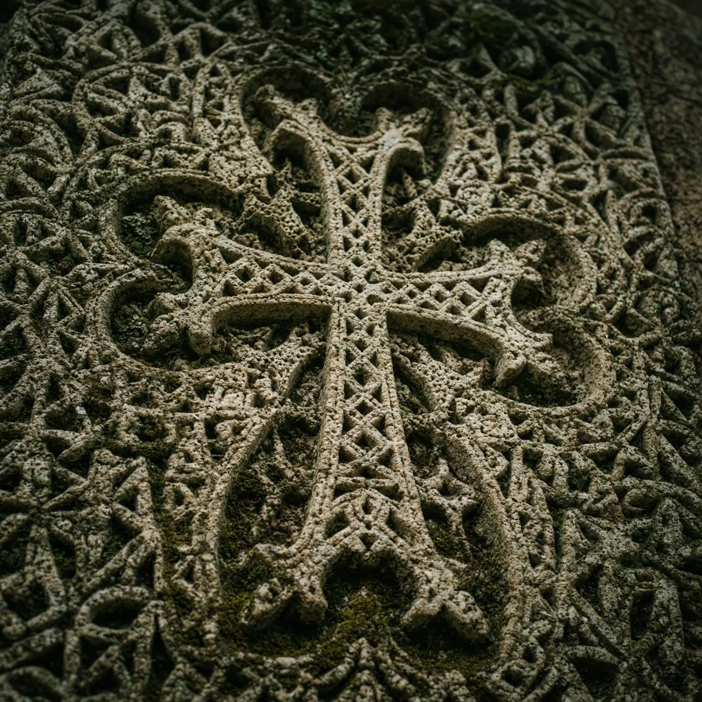An illustrative woven textile detail inspired by carved stone patterns.