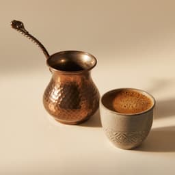 A copper jazve beside a cup of Armenian coffee