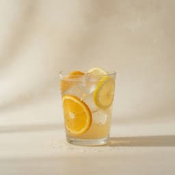 Citrus lemonade over ice with lemon and orange