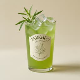 Bright green tarkhun lemonade with a tarragon sprig
